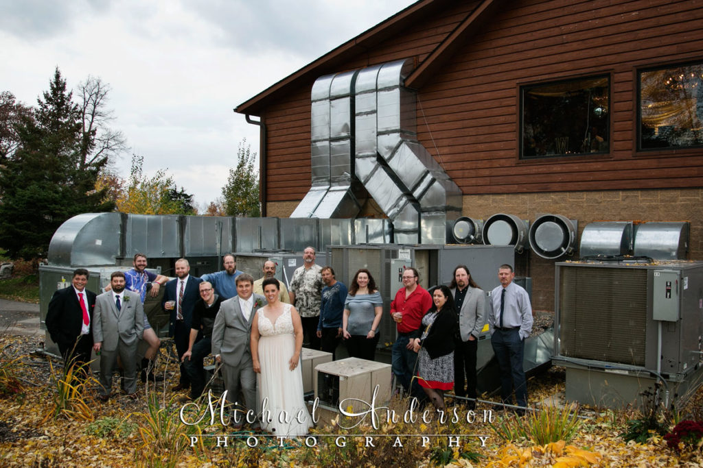 Bride, groom and the Airic's Heating crew in front of the heating and air conditioning system their company installed at the Minnesota Horse and Hunt Club.