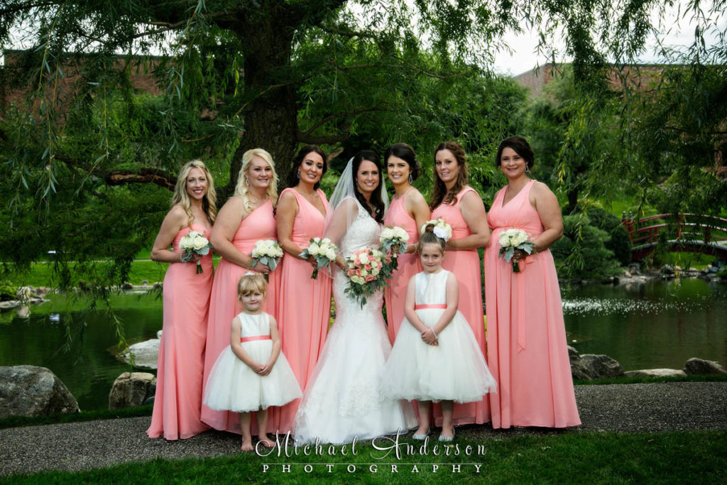 Wedding photography at The Japanese Garden at the Normandale Community College in Bloomington, MN. A pretty wedding photograph of the bride, her bridesmaids and two flower girls.