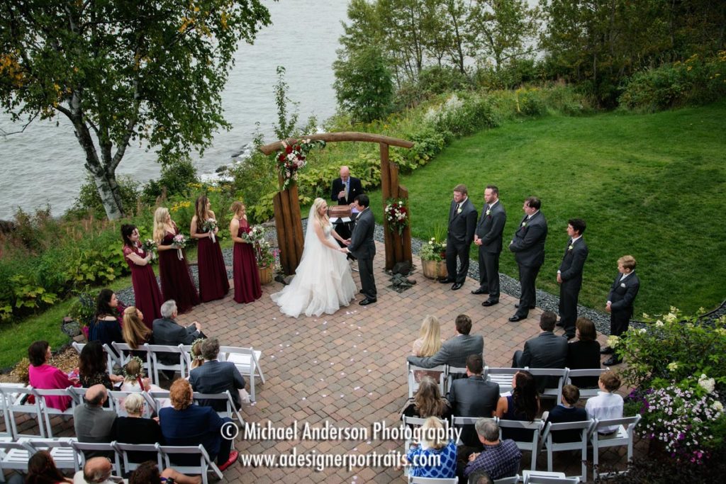 A pretty view of a Grand Superior Lodge destination wedding ceremony taken from the lodge balcony above the patio.