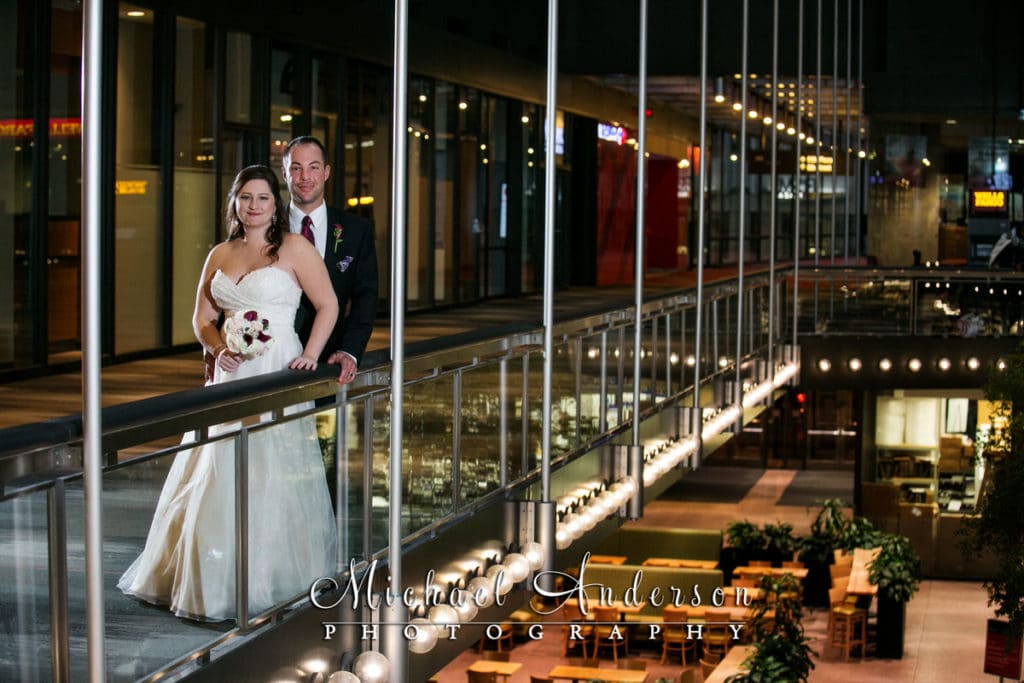 A classic wedding photo taken moments after their Windows On Minnesota wedding. Matt & Jennifer on the second floor in the Crystal Court of the IDS Center.