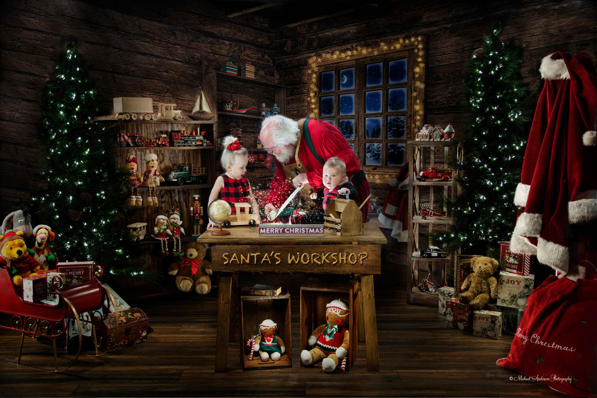 and his big sister taking a look at Santa's naughty and nice list at T...