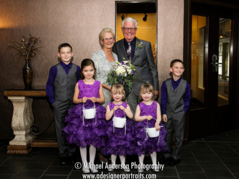 The bride and groom along with their adorable junior wedding party. Wedding photograph was taken at their Crown Plaza Plymouth wedding.