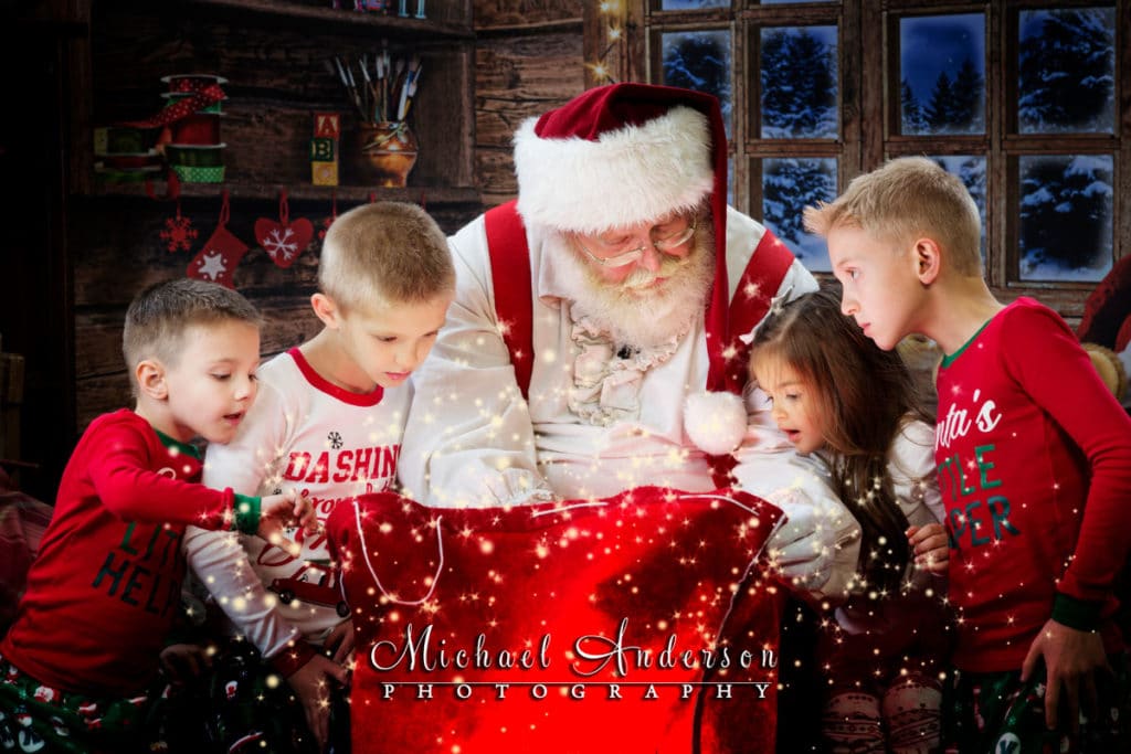 More Storytime with Santa portraits for The Best Santa Experience. Four kids get to peek into Santa's magical toy bag, magic pixie dust and all!