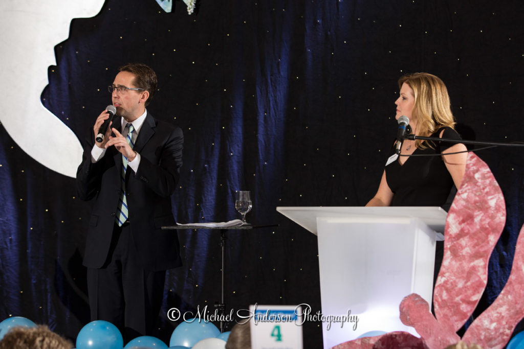 Auctioneer Glen Fladeboe and emcee Megan Newquist at The 6th annual Home Plate Gala for Crescent Cove in Brooklyn Park, MN.