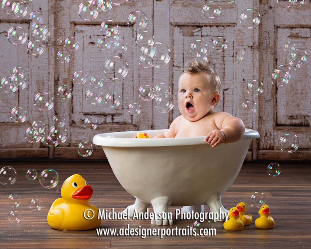 Bath Time baby photos of an adorable nine-month-old boy in a bathtub.