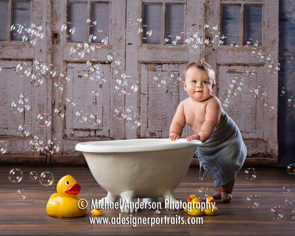 Mounds View Photographer. Bath Time baby photos of an adorable nine-month-old standing in a towel.
