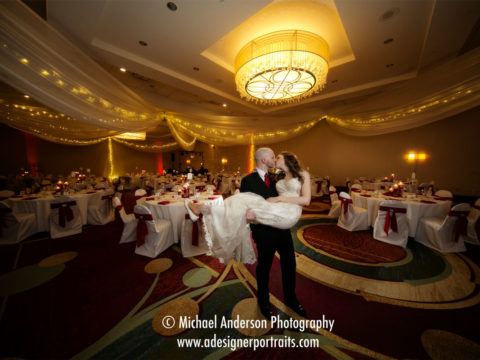 Wedding photography Minneapolis Marriott Northwest. Ultra wide angle wedding photo of the bride and groom in their ballroom.