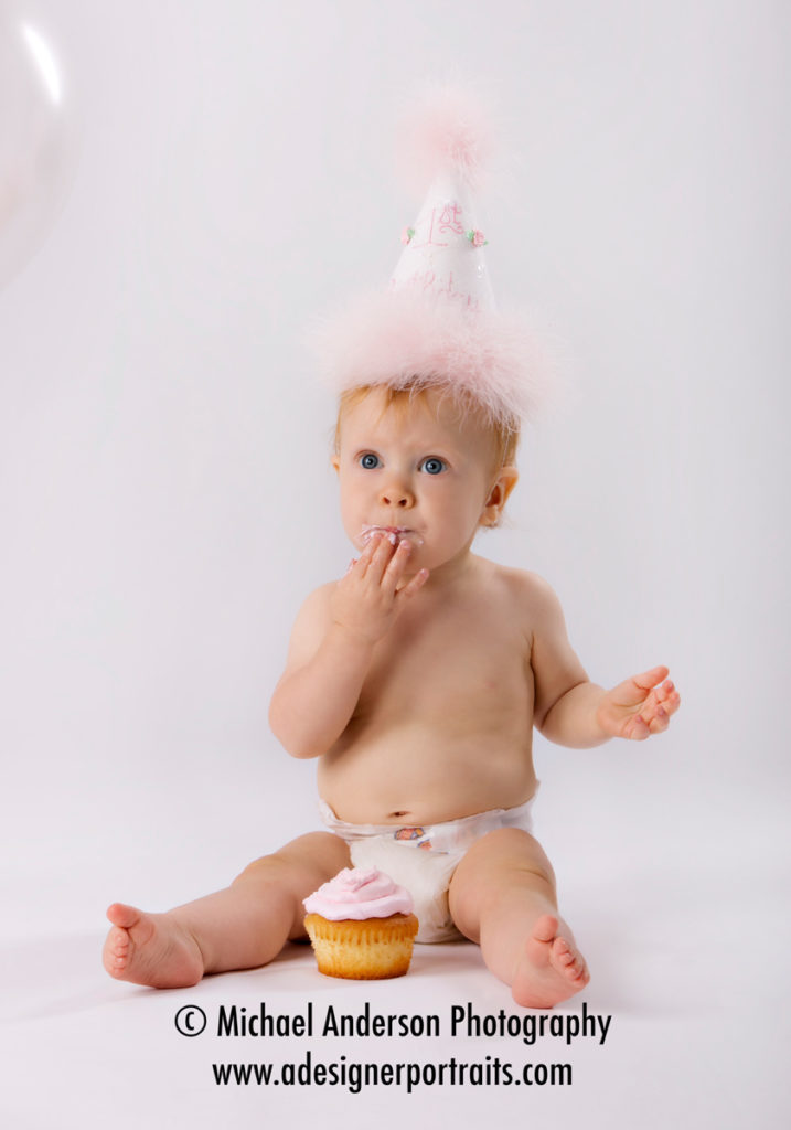 Katie's First Birthday Portraits. She enjoys her very own private birthday cake.