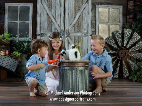Mounds View MN Portrait Photographer Easter Photos With Real Bunnies. Three siblings pose and play with two real bunnies.