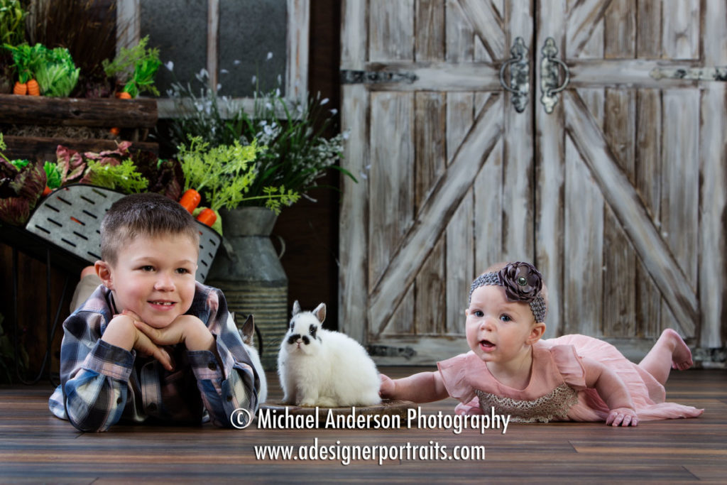Mounds View MN Portrait Photographer Easter Bunny Photographs. A fun Easter Bunny photo of a cute five-year-old boy and his baby sister with two real bunnies.
