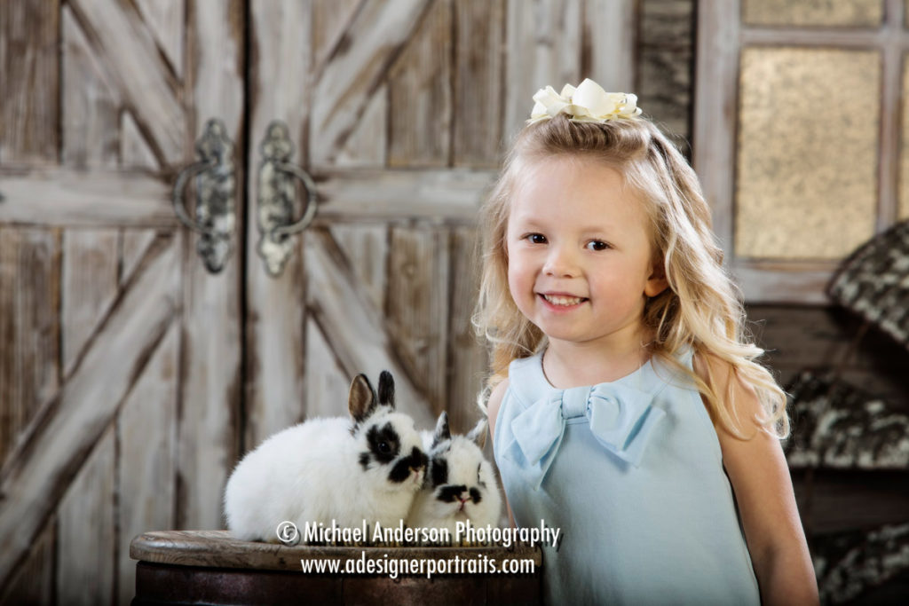 Mounds View MN Photographer Easter Bunny Photos 2018. Easter bunny photo of an adorable four-and-a-half-year-old girl with two bunnies.