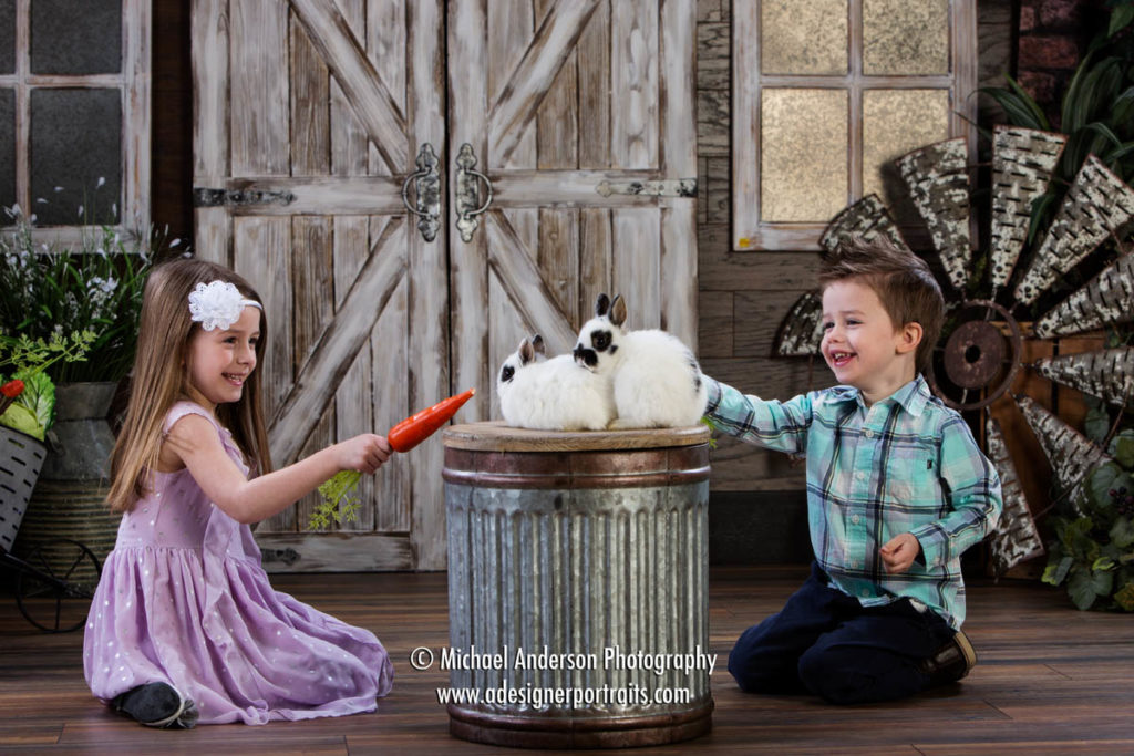 Mounds View MN Photographer Easter Bunny Photos 2018. A brother and his big sister having fun with two bunnies!