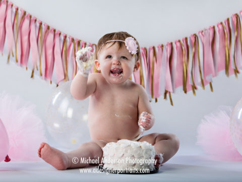 Mounds View MN Kids Photographer One-Year-Old Portraits of Mackenna. Mackenna enjoys her one-year-old-birthday cake!