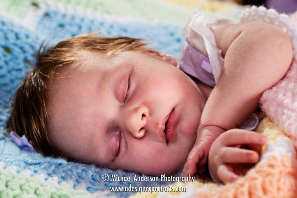 Charlotte takes a little nap during her eleven-day-old newborn photos.