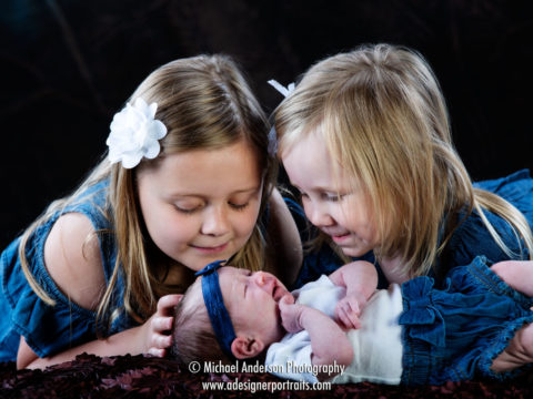 Three week old newborn photos of little Lydia along with her big sister Kylie and cousin Kenzie.