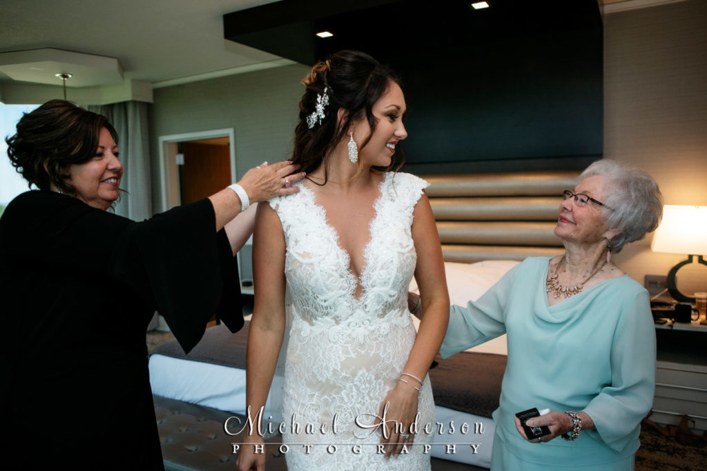 Mystic Lake Casino wedding photo of the bride sharing a tender moment with her mom and grandmother.