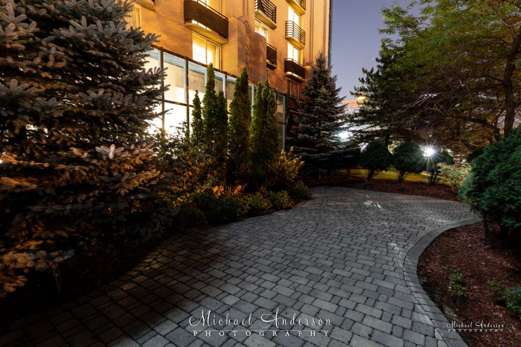 The Embassy Suites Minneapolis Airport courtyard at night.
