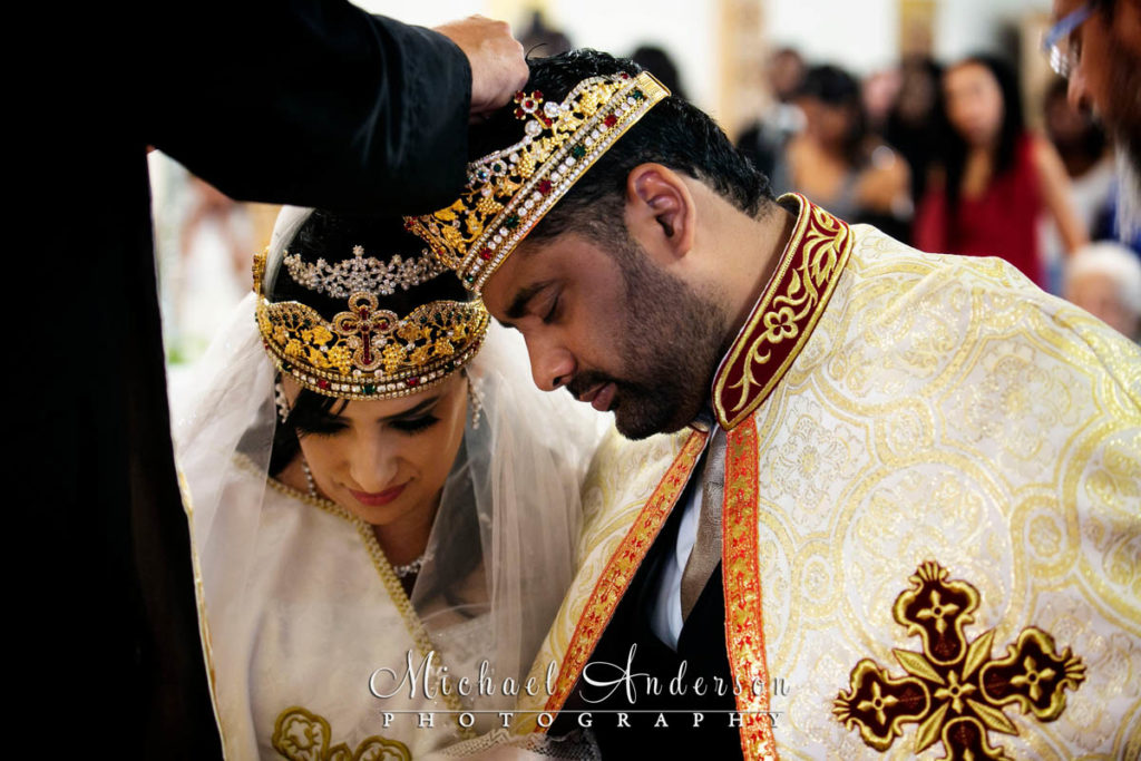 Saint Mary's Coptic Orthodox Church wedding photographs of the bride and groom during their wedding ceremony.