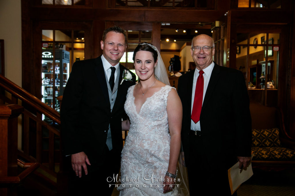 TPC Twin Cities wedding photographs of the bride and groom with Judge Tom Armstrong.