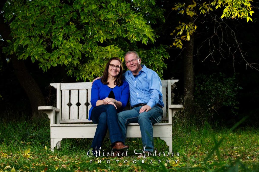 Rotary Nature Preserve engagement portraits of a cute couple on a white park bench.