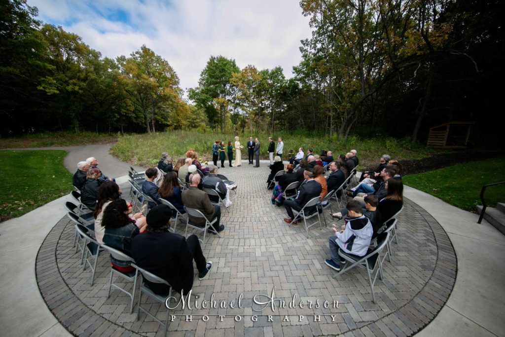 Springbrook Nature Center wedding photos of a wedding ceremony in the outdoor amphitheater.
