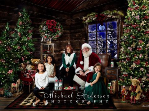 Four sisters meet Santa Claus and poses for a picture with them too!