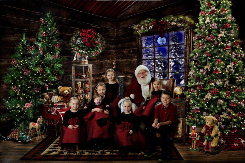 Seven cousins meet Santa Claus at The Best Santa Experience at Michael Anderson Photography in Mounds View, MN.