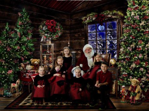 Seven cousins meet Santa Claus at The Best Santa Experience at Michael Anderson Photography in Mounds View, MN.