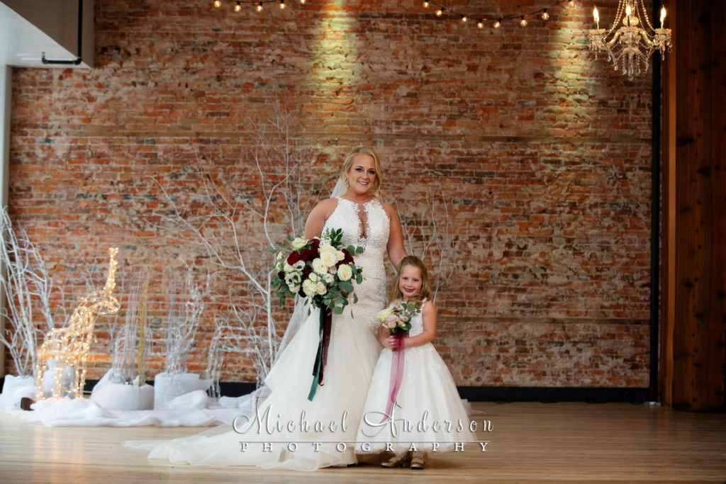 The 3 Ten Event Venue wedding photos of the bride and her flower girl.