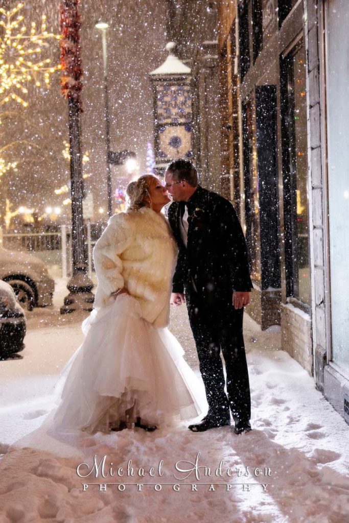 The 3 Ten Event Venue wedding reception photos of a bride and groom outside at night in a blizzard!