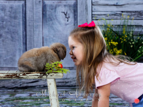 2019 Easter photos of a cute four-year-old girl nose to nose with a cute bunny.