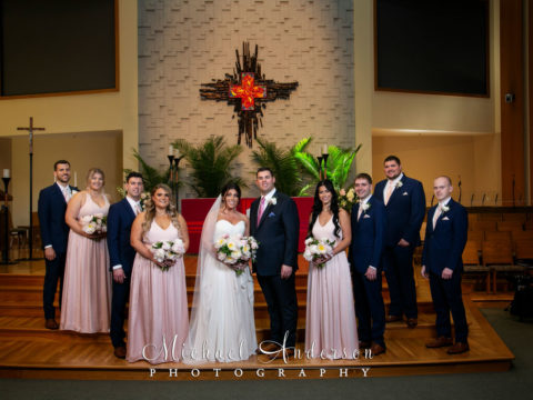 Beautiful Savior wedding photo of the entire wedding party at the altar.