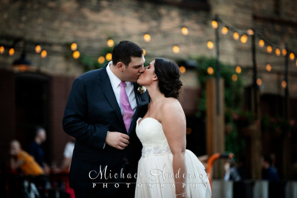 A pretty twilight photograph of the bride and groom at the Solar Arts Building in Minneapolis, MN.