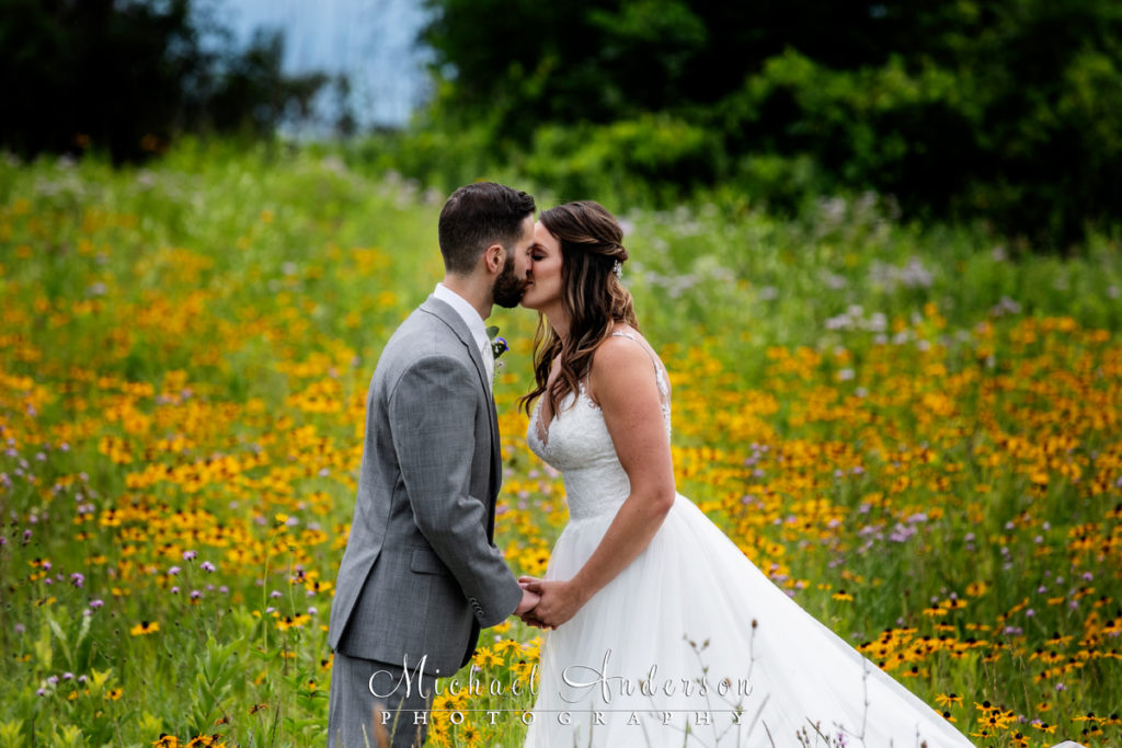 Long Lake Regional Park wedding photos of the bride and groom in a field of wildflowers.