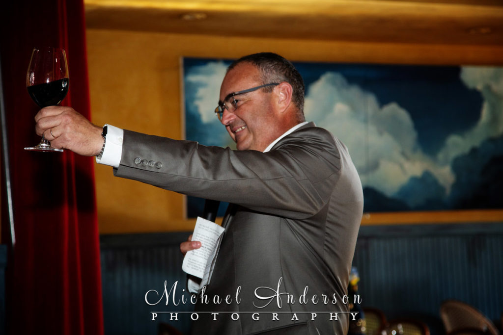 Cave Vin wedding reception photograph of the bride's father giving a toast to the couple.