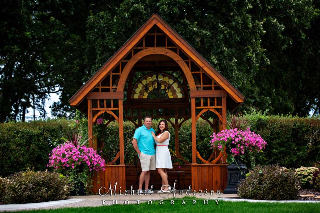 Little Log House Pioneer Village engagement photograph of a cute couple in front of a gazebo.