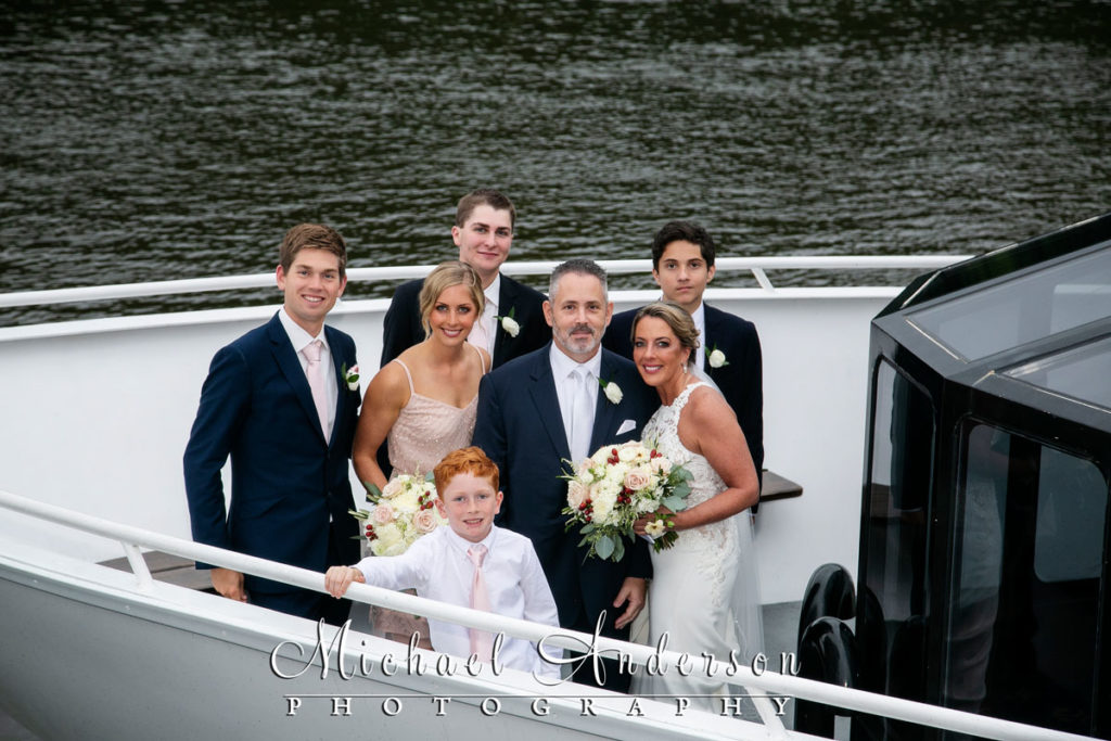 A bride, groom, and their wedding party onboard the Paradise Lady.