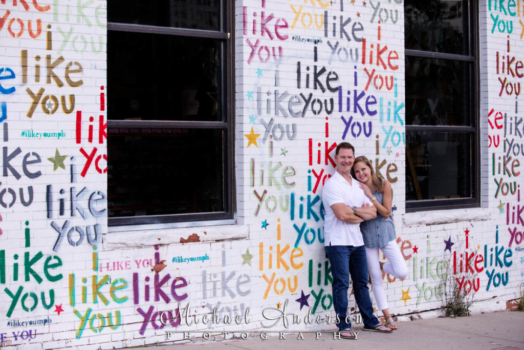 Engagement photo taken at the "I Like You Wall" in Minneapolis, MN.