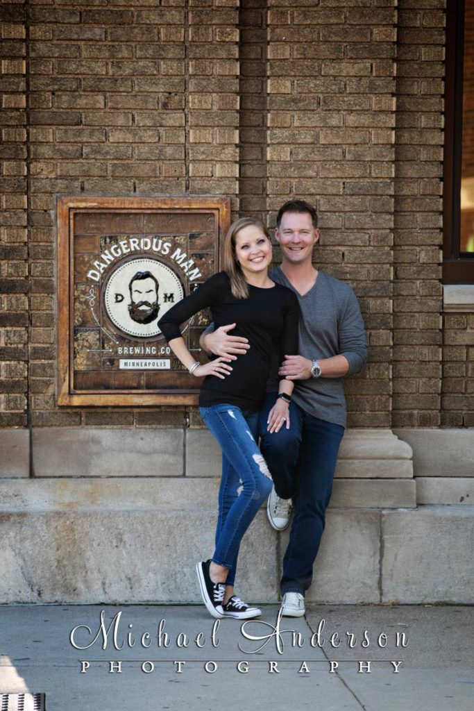 Engagement photo in front of The Dangerous Man Taproom.