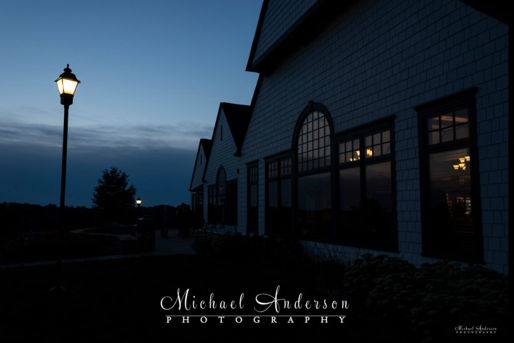 Photograph of the outside of the Keller Clubhouse in Maplewood, MN at dusk.