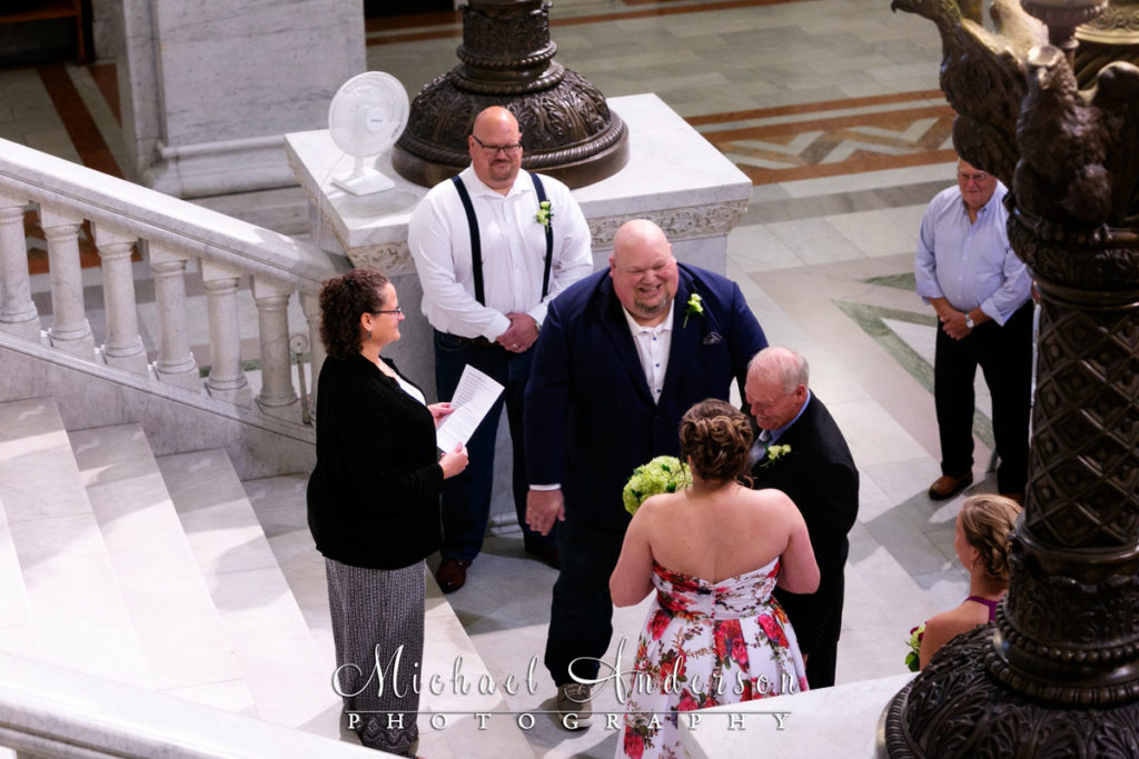 A bride and groom exchange wedding vows at the Historic Minneapolis City Hall.