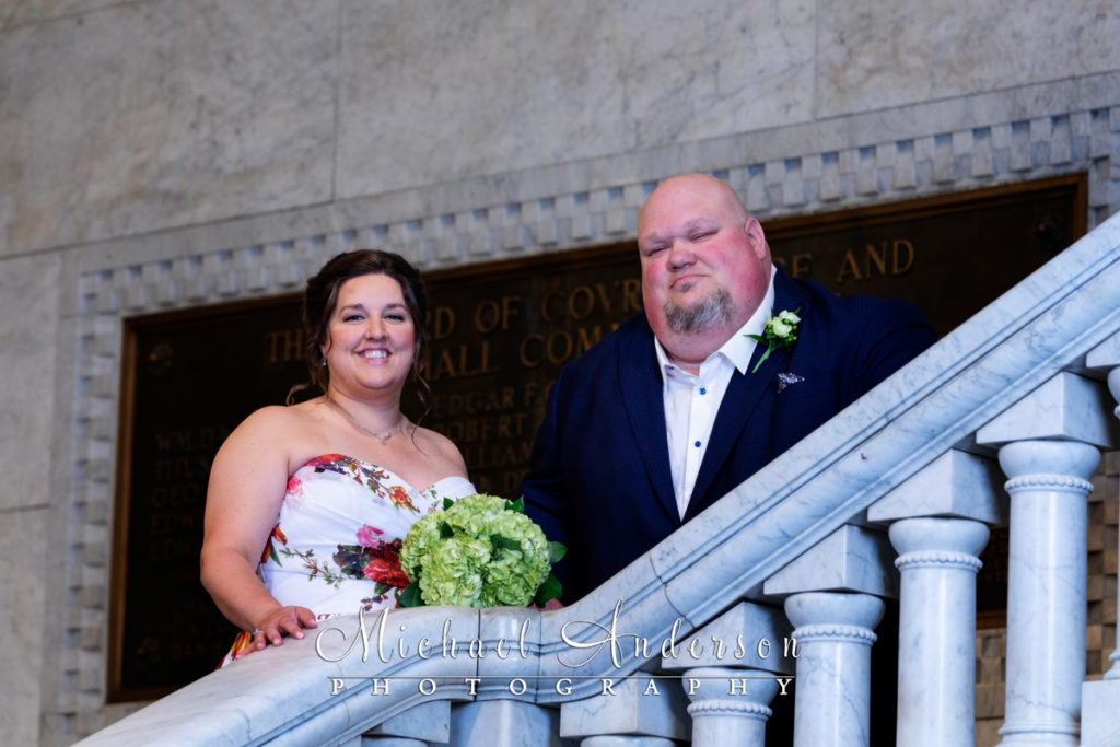 A nice portrait of a bride and groom on the marble staircase of Minneapolis City Hall.