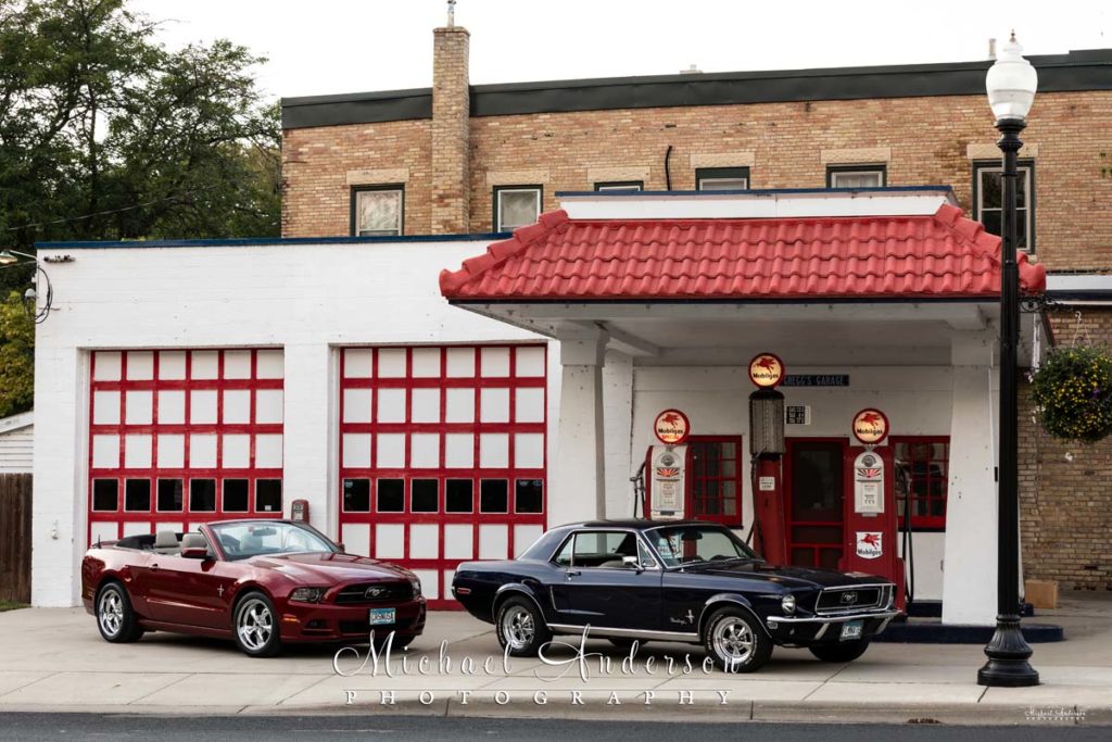 A 1968 and a 2014 Mustang at Gregg's Vintage Restored Gas Station in Carver, MN.