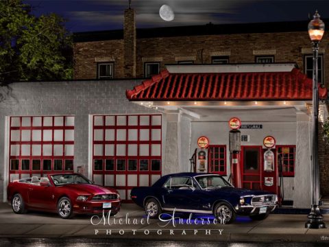 A pair of light painted Ford Mustangs, a 1968 and a 2014. Image created at Gregg's Vintage Restored Gas Station in Carver, MN.