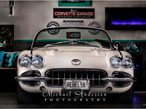 A light painting a 1958 C1 Corvette in a retro she shed.