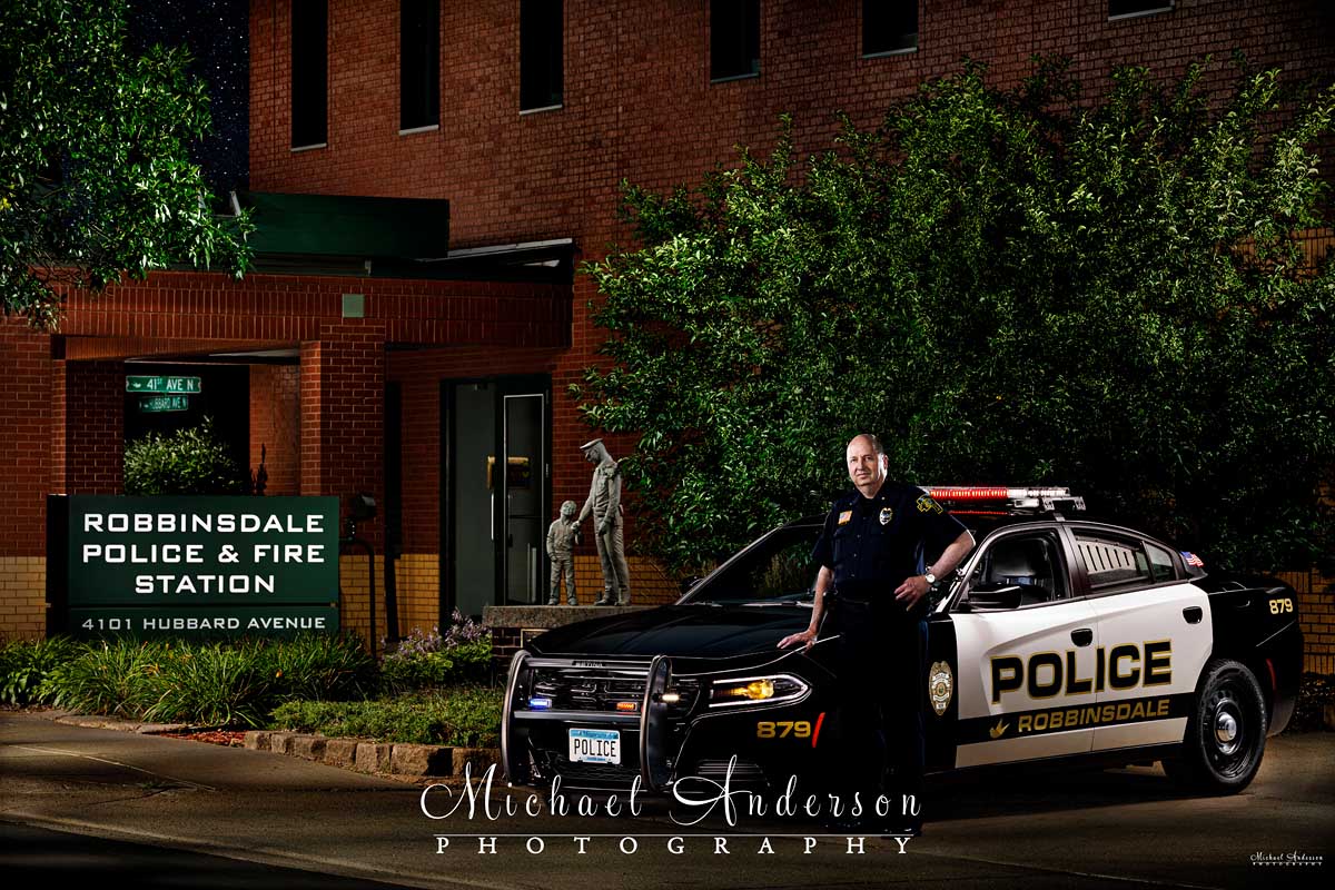 A really cool light painting of the Robbinsdale Chief of Police and a Dodge Charger Police Interceptor.