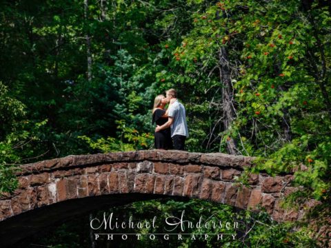 Pretty engagement photos at Glensheen Mansion taken on the stone arch bridge.