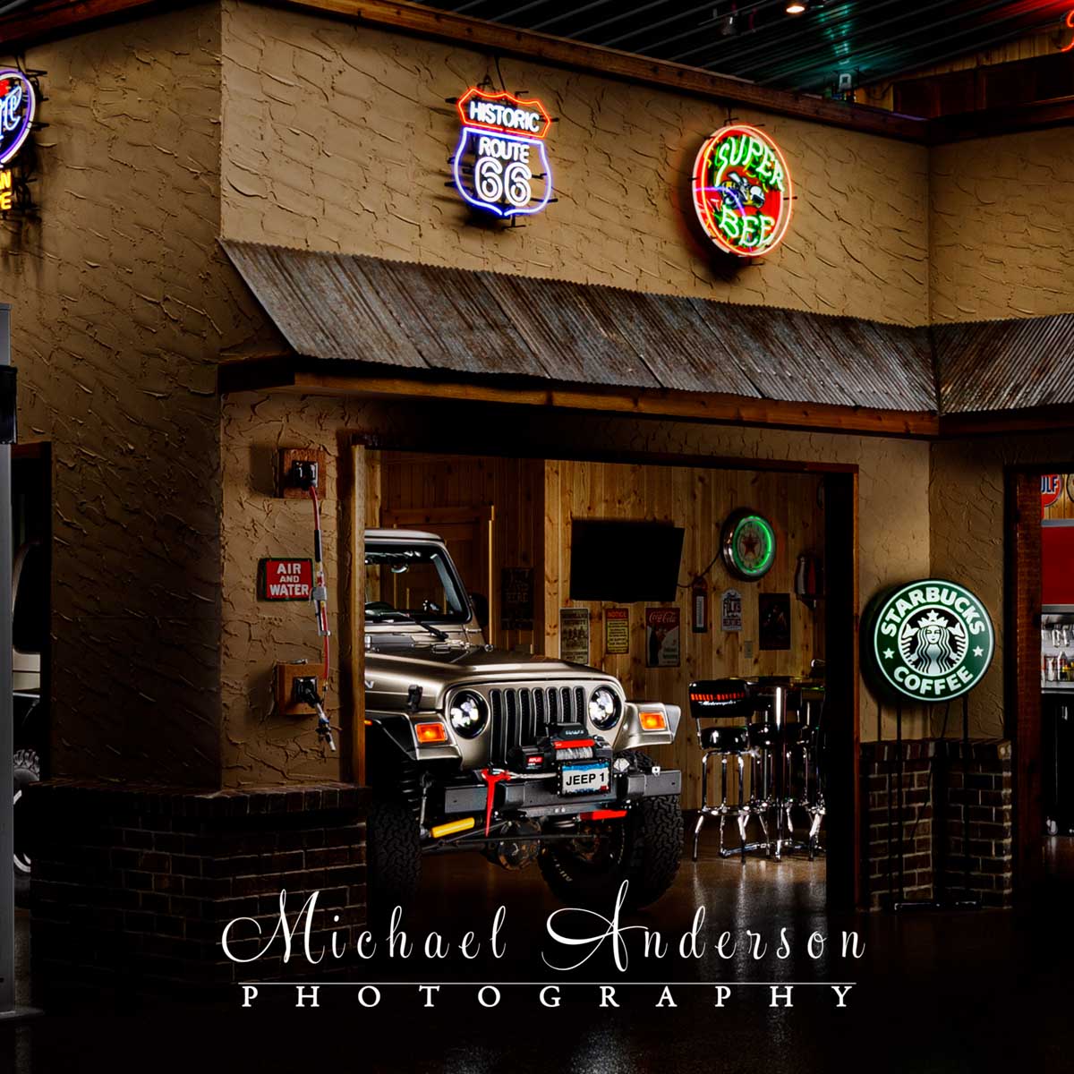 A light painted photograph of a 2003 Jeep Rubicon in a Man Cave.