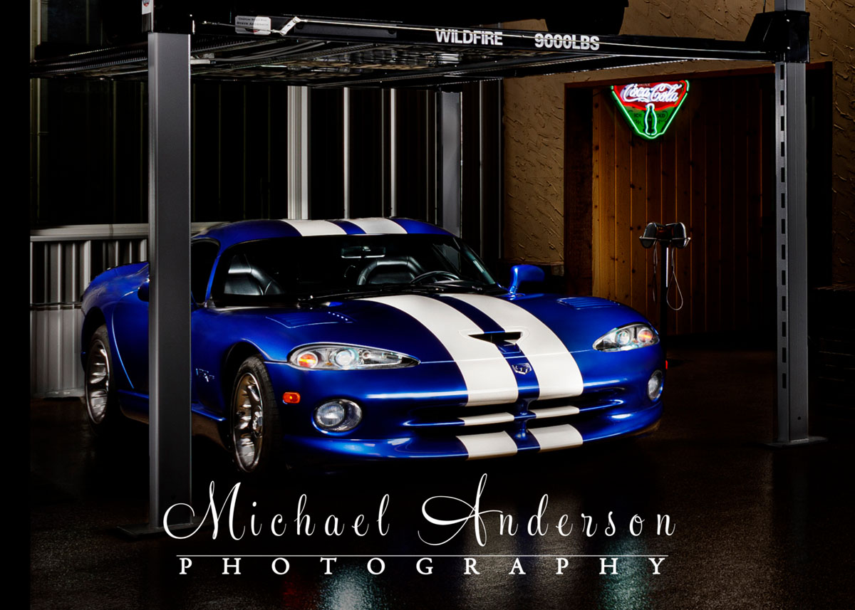 A light painted photograph of a 1996 Dodge Viper GTS Coupe in a Man Cave.