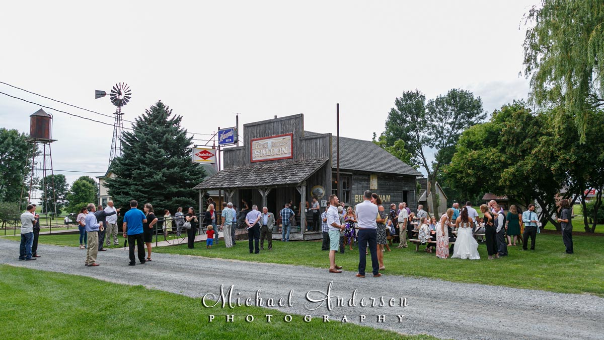 Wedding guests at Four Corners Saloon social hour at the Little Log House Pioneer Village wedding reception.